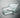 Square pieces of transparent acrylic sheeting on a gray background