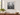 20 x 20 wall-mounted clear acrylic floating frame with gold standoffs displaying a black-and-white New York City photograph.